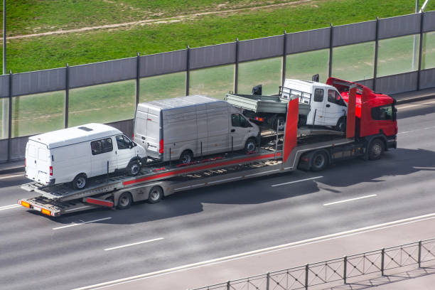 Heavy truck with trailer platform tow for transporting mini buses on the city highway